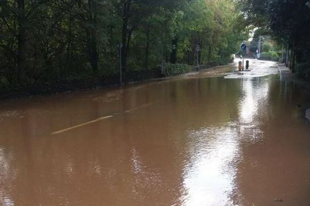 Damage caused by burst water main on Manchester Road, Greenfield at the junction with Dacres Road.