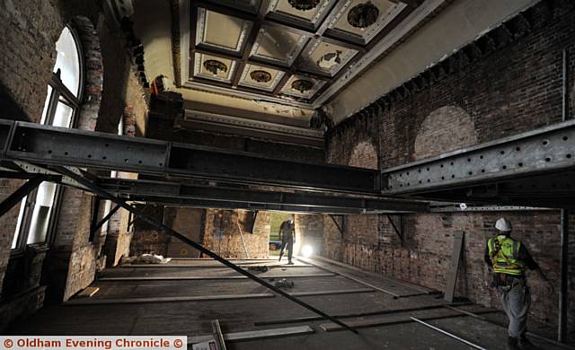 DOWN to the bare bricks, the former council chamber