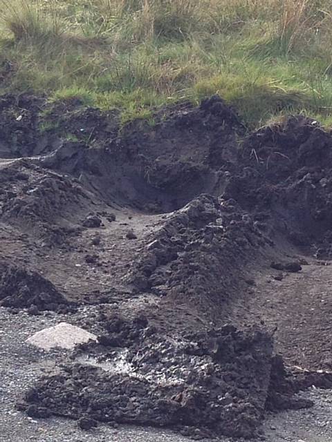 POLICE on the scene as the lorry remains stuck in the mud