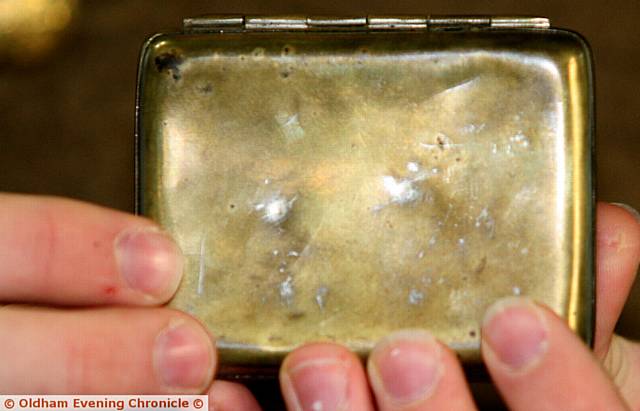 SAVIOUR . . . the actual cigarette tin that saved Max's great-grandfather's life on the front line ­ two dents can be seen in the tin from two bullets fired at him
