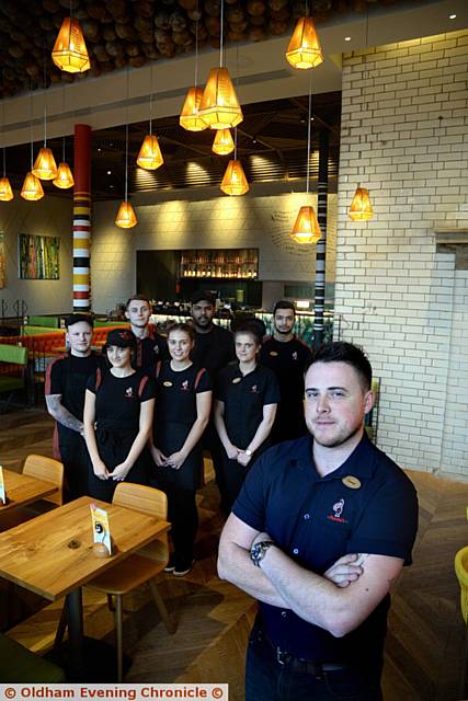 Nando's Unit 2 Oldham Town Hall, Oldham opens. Pictured here is (right) General Manager Jamie Rust and some of the staff.