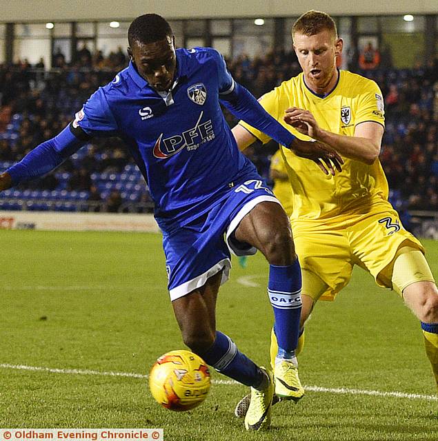 HOLD UP PLAY . . . front man Freddie Ladapo shields the ball