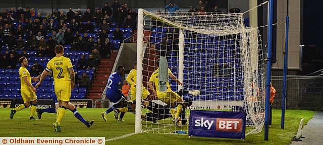 DID THE BALL CROSS THE LINE? . . . Freddie Ladapo's header bounces down off the crossbar in the 89th minute against the Dons, but appeals for a goal were waved away