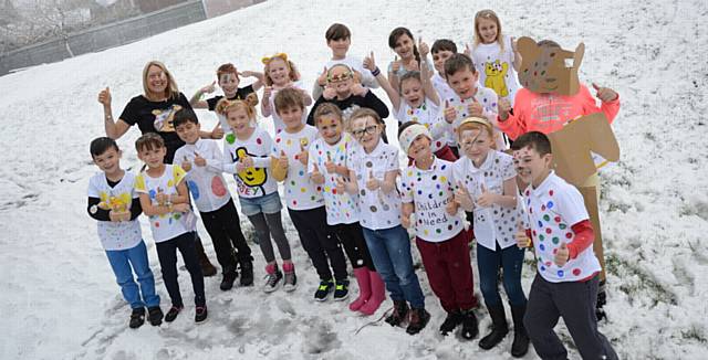 Children at Hodge Clough Primary School in Moorside brave the bad weather