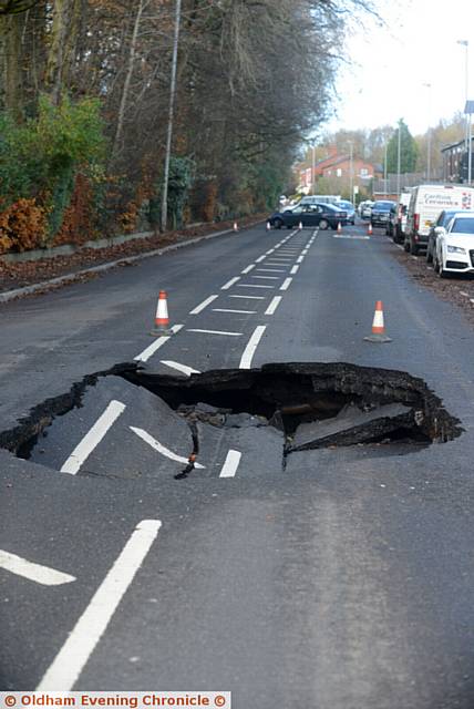 A huge sink hole has appeared in the centre of Rochdale Road, near Tandle Hill Park.