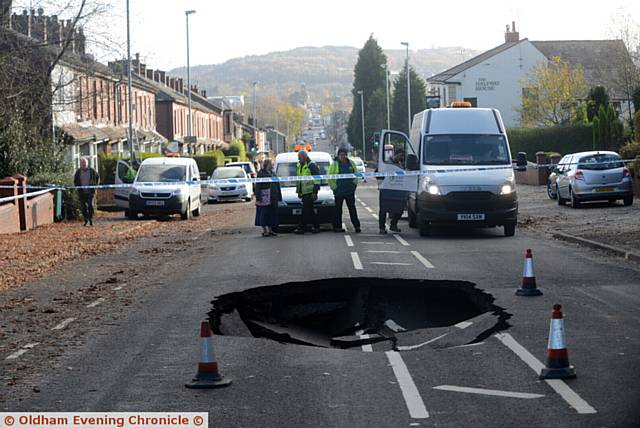 A huge sink hole has appeared in the centre of Rochdale Road, near Tandle Hill Park.