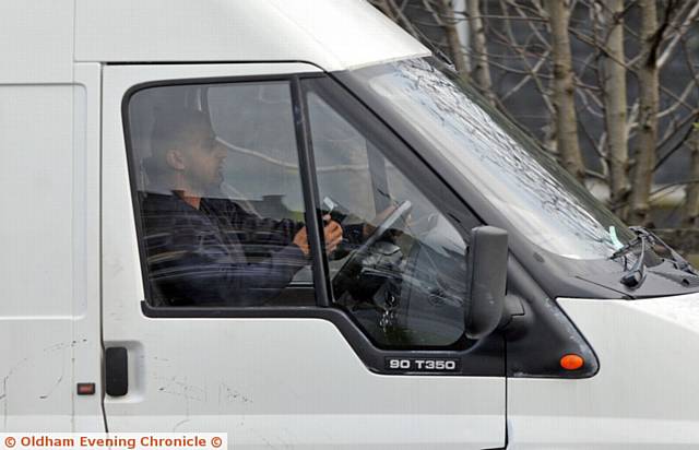 Drivers using mobile phones whilst driving on Oldham Way.