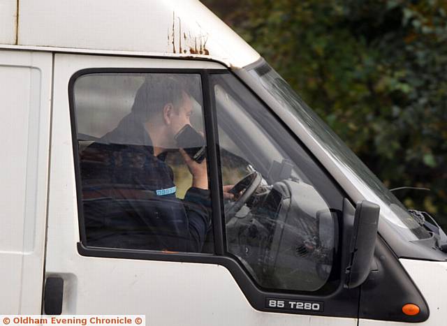 Drivers using mobile phones whilst driving on Oldham Way.