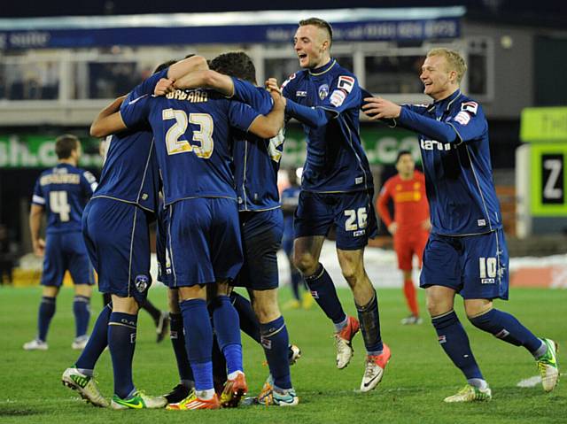 GREAT GAME . . . Carl Winchester (second right) joins in the celebrations after Reece Wabara's goal against Liverpool in the FA Cup