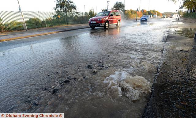 Water burst on Hollinwood Avenue next to the Victoria Hotel.