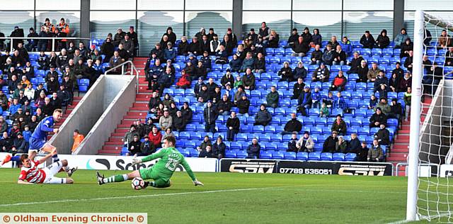 THAT MAKES TWO . . . Billy Mckay neatly tucks away Athletic's second goal.