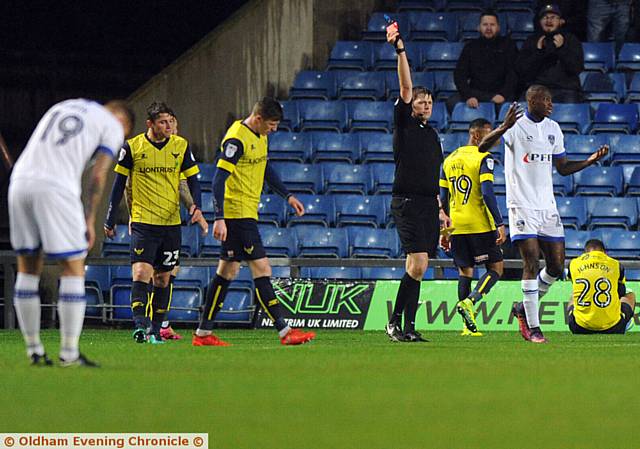 OFF YOU GO . . . referee Brett Huxtable brandishes a red card towards Athletic midfielder Ousmane Fane. 
