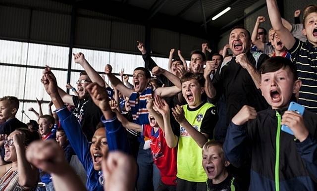 DAVID SHAW'S picture captures the delight of Latics fans celebrating a goal