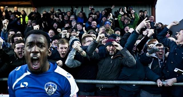 Latics fans at a match, featured in David Shaw's book 'Oh When The Blues'. 