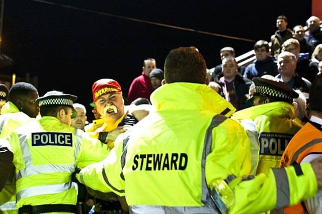 Tony Feely, who dresses up as Hulk Hogan', at a match in Rochdale. Featured in David Shaw's book 'Oh When The Blues'.