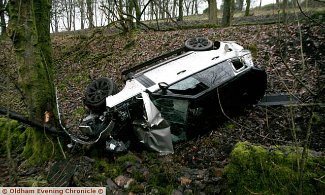 RTA on the Delph New road, where a Range Rover left the road and ended up in a small woodland taking out electricity poles. The 4x4 looks like it was traveling from the Delph / Huddersfield road junction of Oldham.