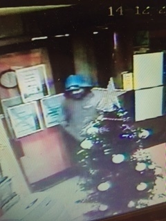 Sunbed shop Armed robbers at Designer Skin, Hollins Road, on December 14. CCTV footage still of the offenders