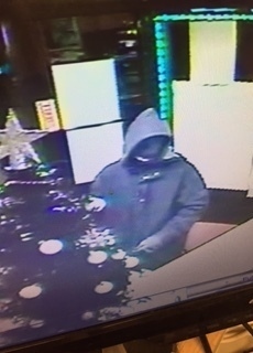 Sunbed shop Armed robbers at Designer Skin, Hollins Road, on December 14. CCTV footage still of the offenders