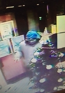 Sunbed shop Armed robbers at Designer Skin, Hollins Road, on December 14. CCTV footage still of the offenders