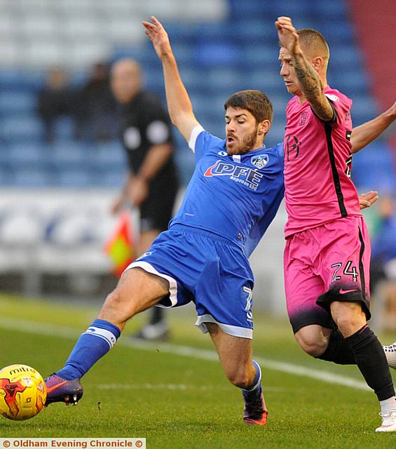 MIDFIELD man Ryan Flynn stretches for the ball