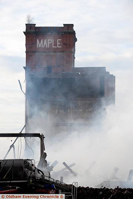 FIRE FIGHTERS and demolitions teams at the Maple Mill     