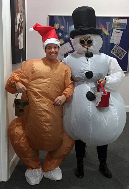 Barbara Dale is the Turkey and Nicola Sweatman the snowman at Oasis Academy, Oldham
