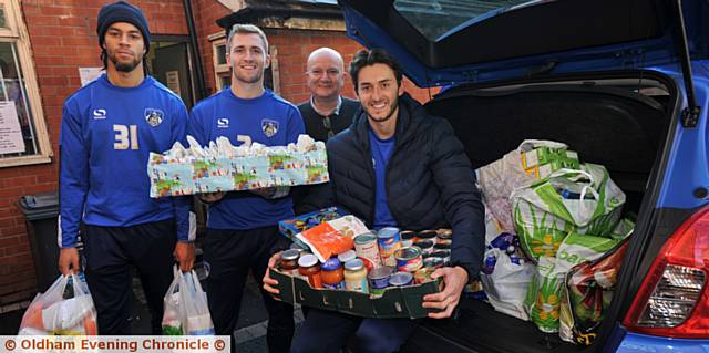 AT the food bank . . . Charles Dunne, Josh Law, Andrew Barr (Foodbank) and Ollie Banks
