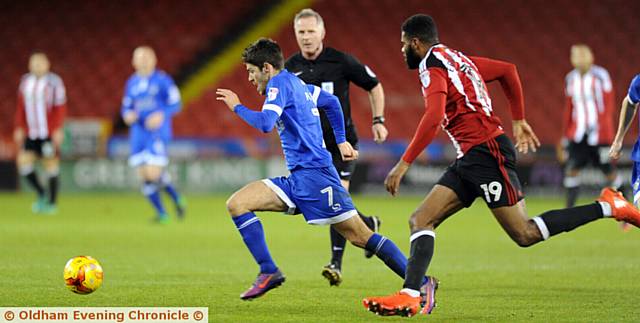 RUNNING GAME... Blades old boy Ryan Flynn attempts to get Athletic moving in the right direction