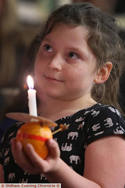 Christingle and Crib service at Oldham Parish church. Pic shows, Alicia Heap, aged 7, from Oldham.