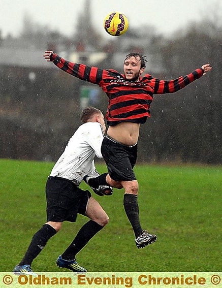 WIDE GUY . . . Adam Wooding, of Oddies 14, goes up for a header.