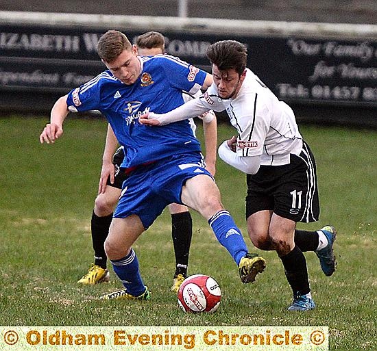 SEEL PARK TUSSLE . . . match-winner Tom Pratt (right) tangles during Mossley’s 2-1 victory against Ossett Town. PICTURE by TIM BRADLEY.