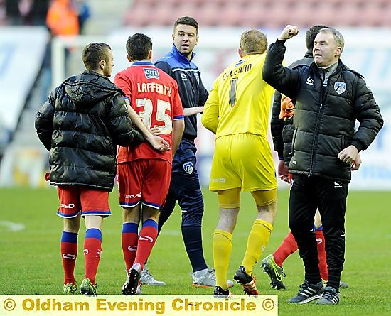 FAN SALUTE . . . John Sheridan acknowledges the travelling army.