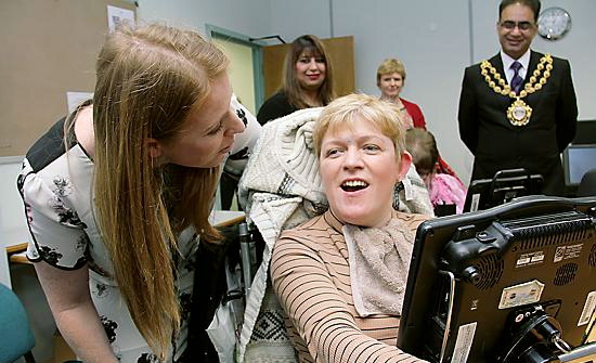 ACE visit: Ashton MP Angela Rayner and the Mayor and Mayoress of Oldham,councillors Ateeque Ur-Rehman and Yasmin Toor, meet Nicola Bush. Nicola has cerebral palsy and communicates using a voice output communication aid that she operates via head tracker.