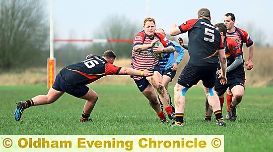 BARGING THROUGH: Oldham’s Jordan McEwan looks for a gap in the Ashton defence.
Ashton 0, Oldham 74 (at Manor Park)