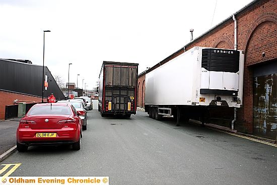 A large trailer parked on double yellow lines on Hamilton street