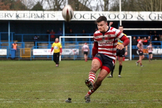 EYES ON THE BALL . . . Oldham skipper Lewis Palfrey kicks for goal against Dewsbury Rams. PICTURES by PAUL STERRITT
