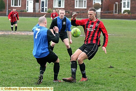 ACTION STATIONS . . . Limeside’s Jerome Slicker (red shirt) gets stuck in.