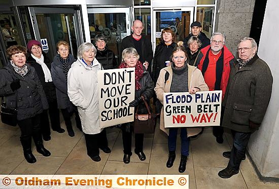 STANDING strong: protesters gather at last night’s meeting.