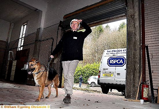 LOCAL RSPCA trustee and treasurer David Haigh looks round the new centre with rescue dog Didley