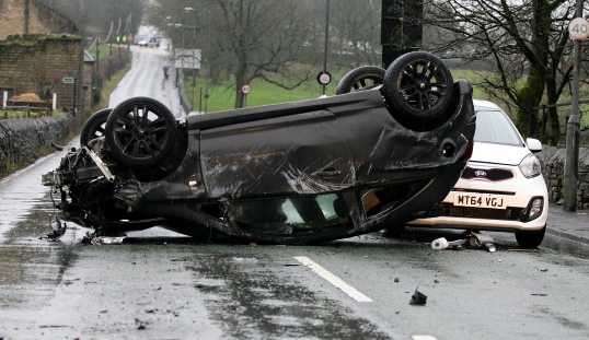 ANOTHER view of the damaged car.