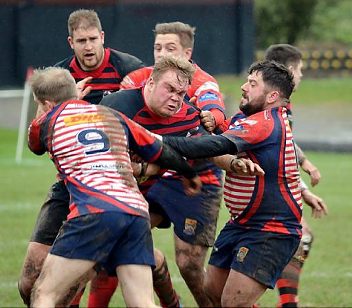 TEAMWORK: Callum Megram (left) and Jamie Edwards combine to stop an Aspatria forward.
