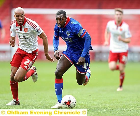 CAPTAIN FOR THE DAY . . . Jonathan Forte tries to get the better of Sheffield United defender Alex Baptiste.