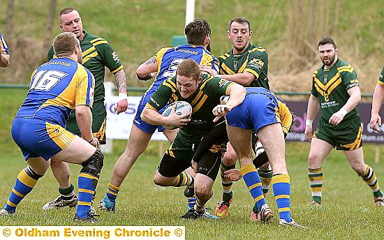 JOHN Deakin bursts through a tackle.