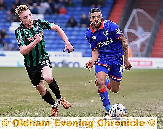 CATCH ME IF YOU CAN . . . new loan signing Tareiq olmes-Dennis tries to get away from Rochdale’s Callum Camps.
