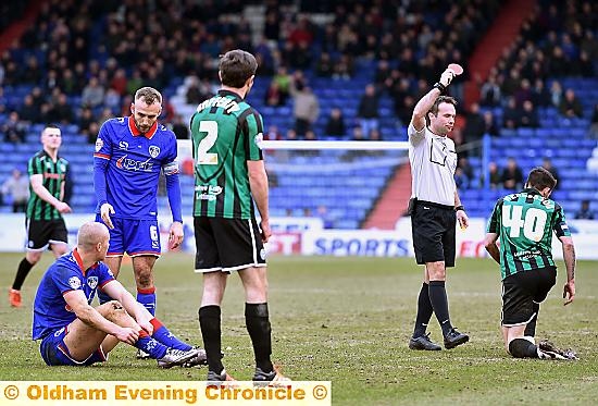 MARCHING ORDERS .. . Rochdale’s Ian Henderson is sent off by referee Paul Tierney after picking up a second yellow card for a foul on Curtis Main (left).
