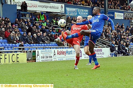 TOE TO TOE: Jonathan Forte battles for the ball in the vital Sky Bet League One clash.