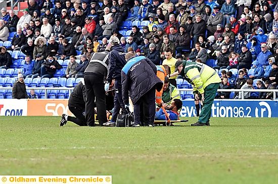 AARON Amari-Holloway is put on a stretcher after picking up an ankle injury yesterday.