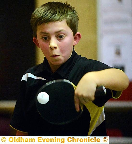 Table tennis league game in Shaw: Unison 'E' player Alex Darlington (12) in the match against Hollinwood 'E'.