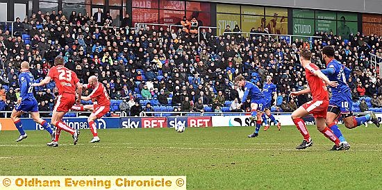 WHISTLED WIDE: Matt Palmer (centre) lets fly against Chesterfield and narrowly fails to hit the target.