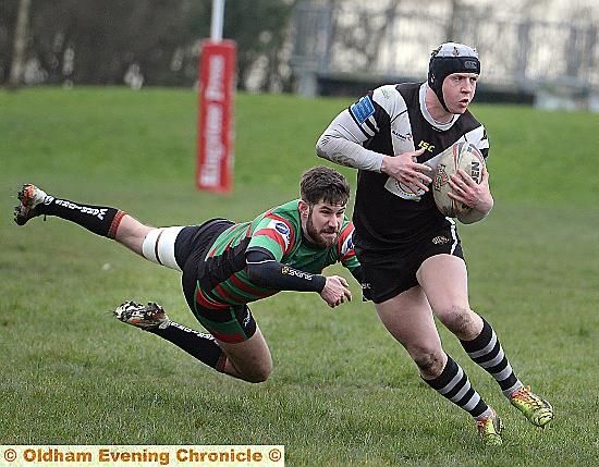 Waterhead’s Patrick Toft (left) attempts to catch Ethan Langhorn, of Saddleworth Rangers. 